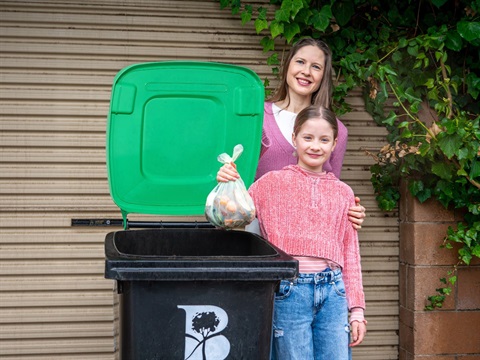 residents with green bin and compost bag.jpg